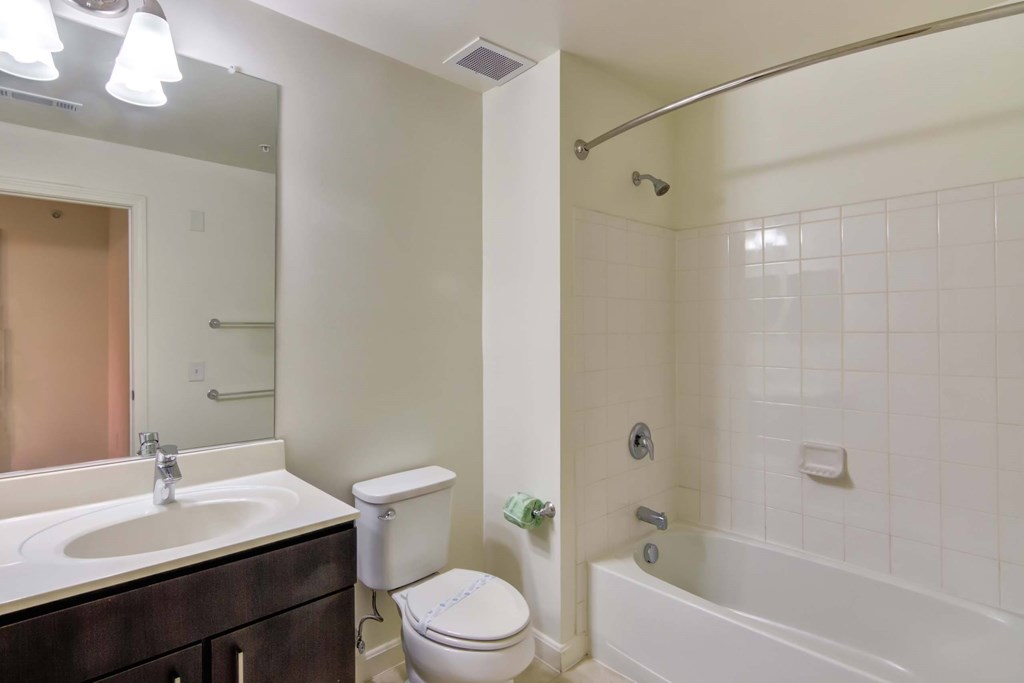 a bathroom with a sink toilet and a bath tub