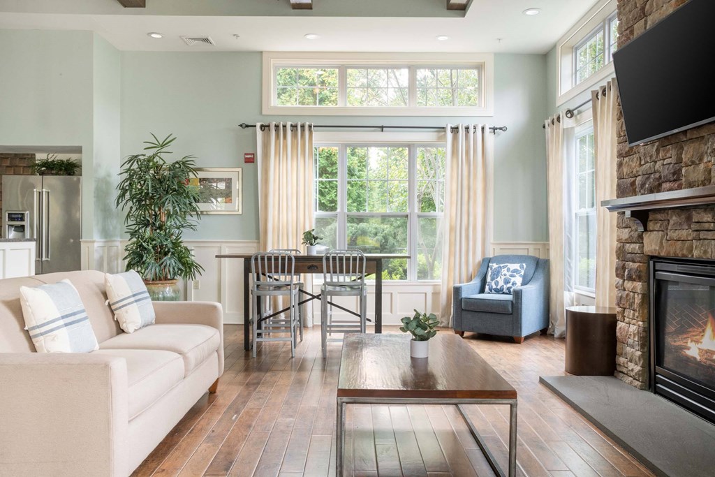 a living room with a couch and a table and a fireplace