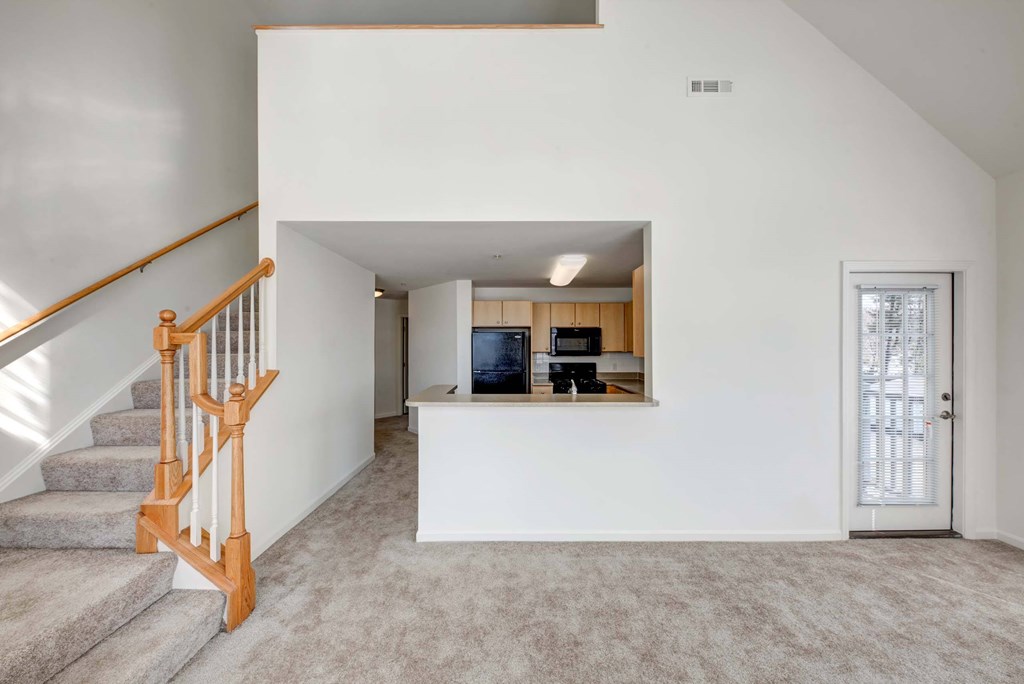 a view of a staircase and a kitchen in a house