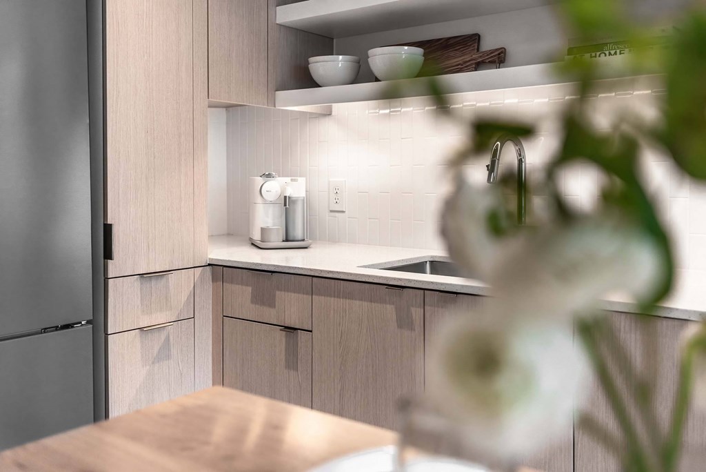 a kitchen with wooden cabinets and a sink