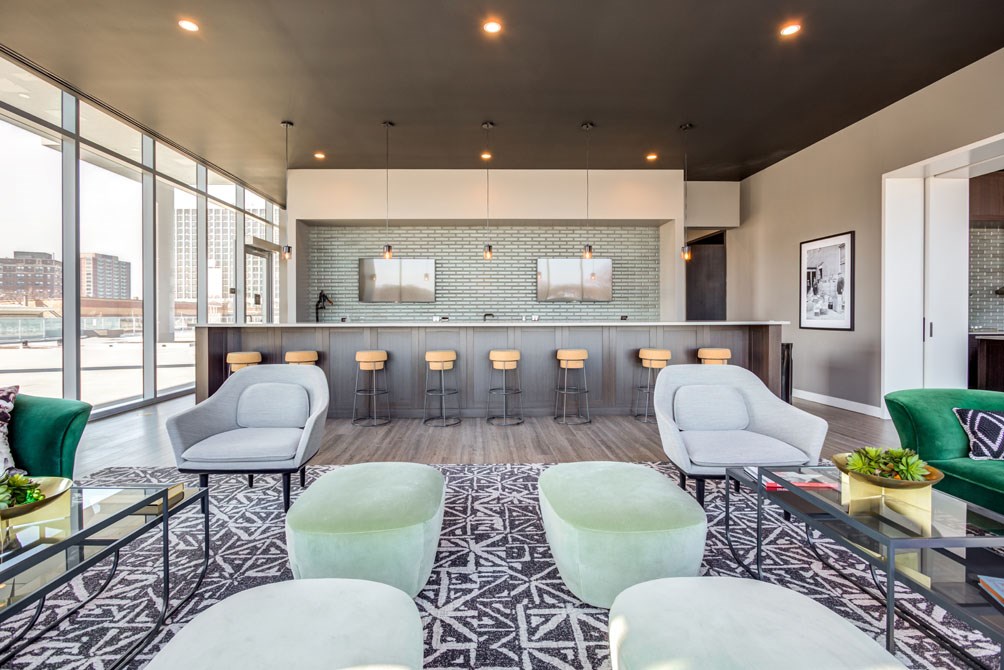 a row of chairs in a room with mirrored walls