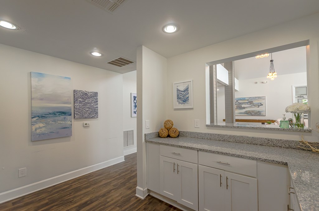 a view of a staircase in a white room with white walls and stairs with crystals
