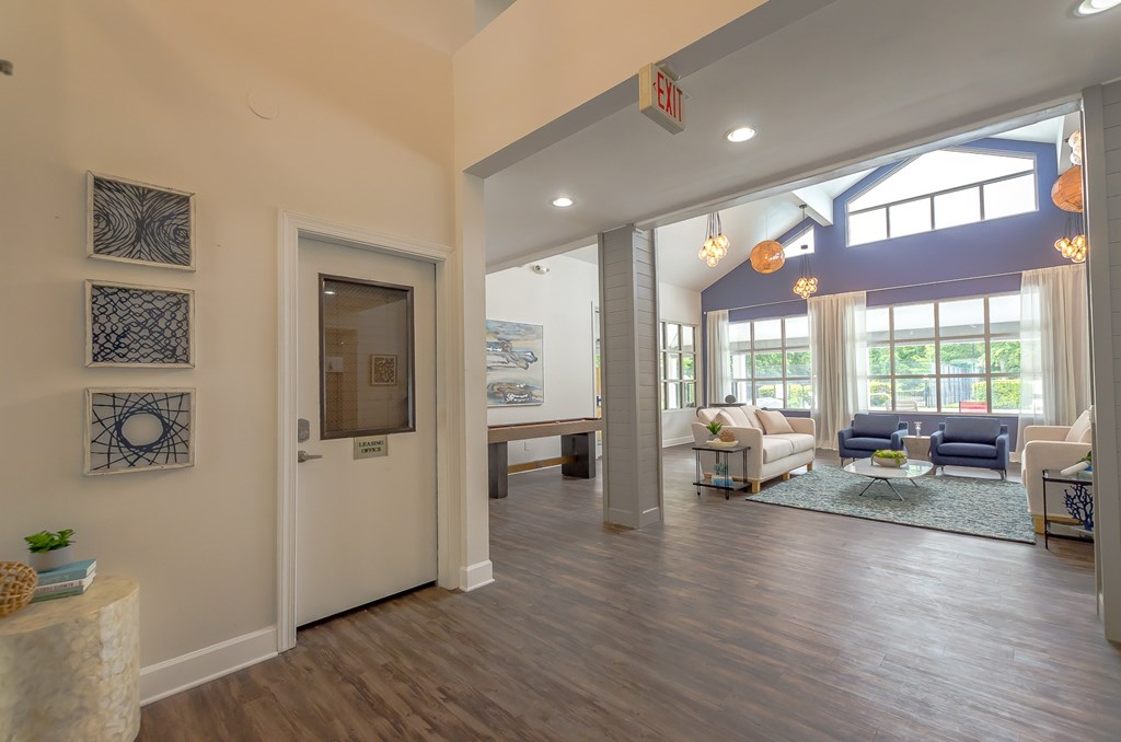 the view of the living room from the foyer of a new home