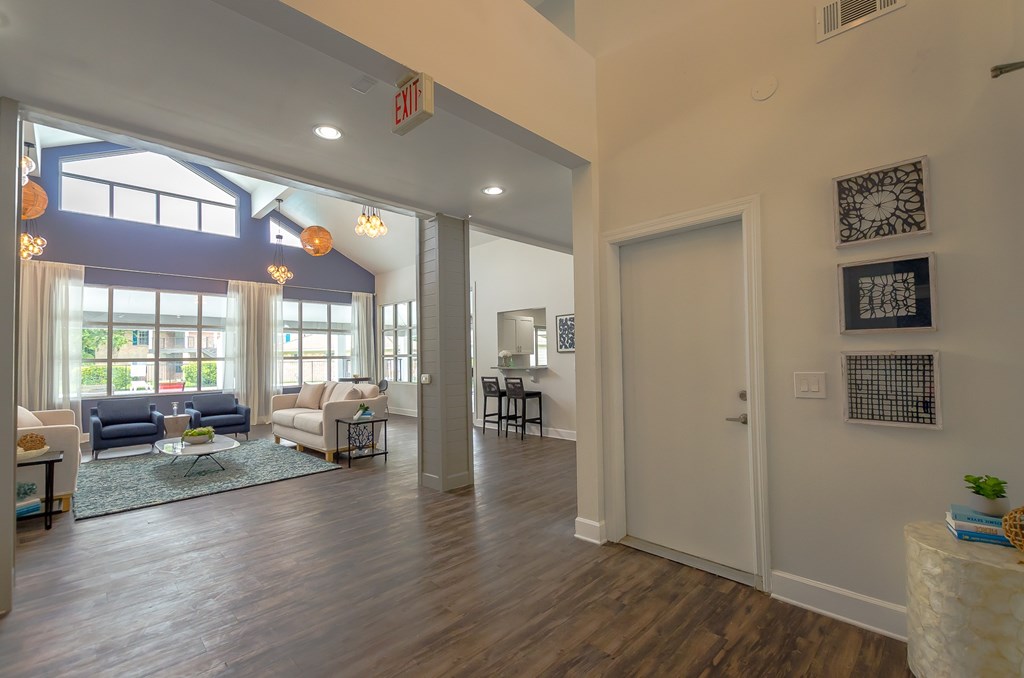the view of the living room from the dining room of a new home