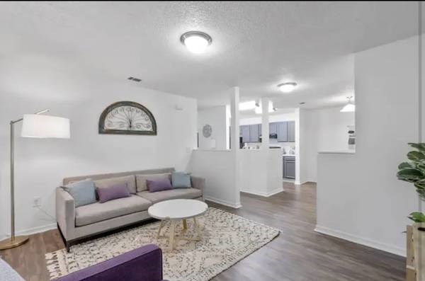 a living room with a couch and a table