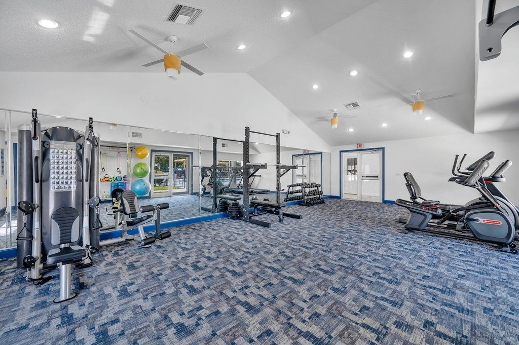 the gym in the clubhouse is equipped with treadmills and other exercise equipment