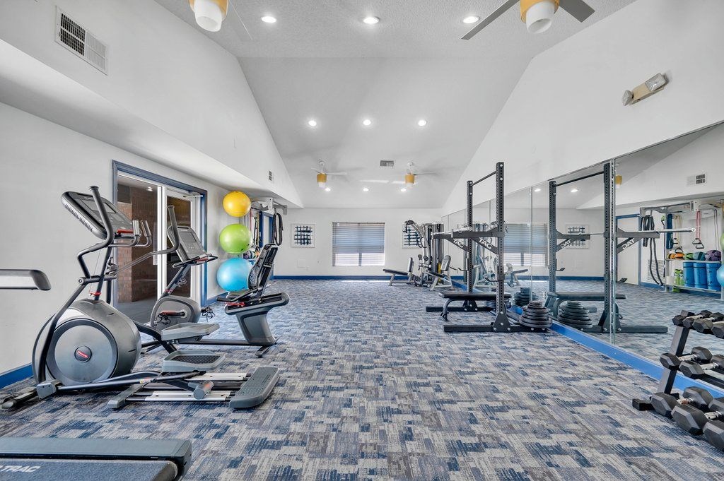 the gym at the preserve at polo ridge apartments in