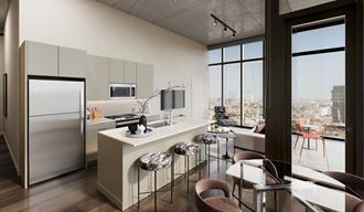 an open kitchen and living room with a city view