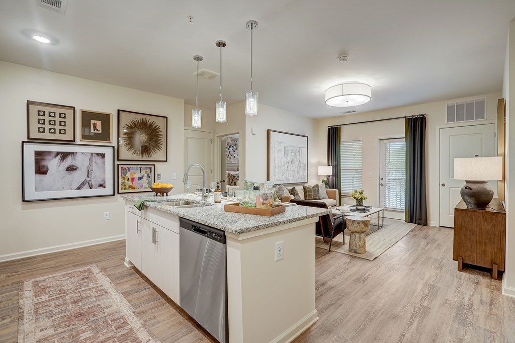 a kitchen and living room with a counter top
