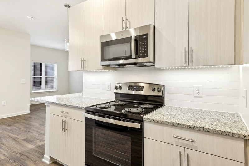 a kitchen with a stove and a microwave