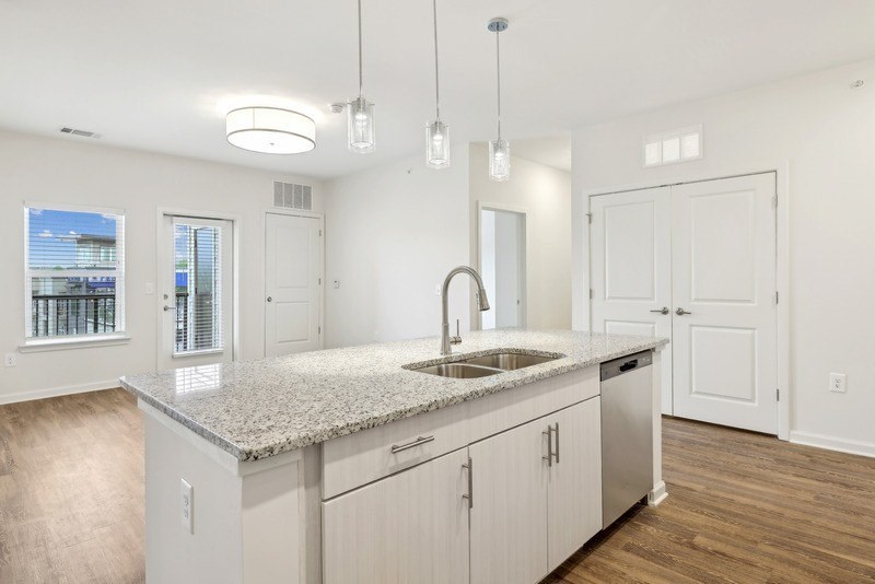 a kitchen with a sink and a counter top