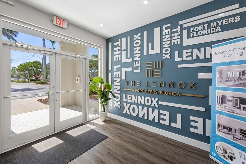 a lobby with a large wall with words on it