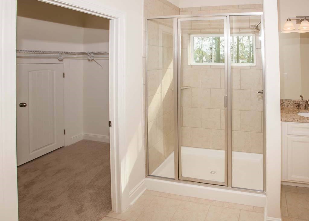 a bathroom with a shower and a sink
