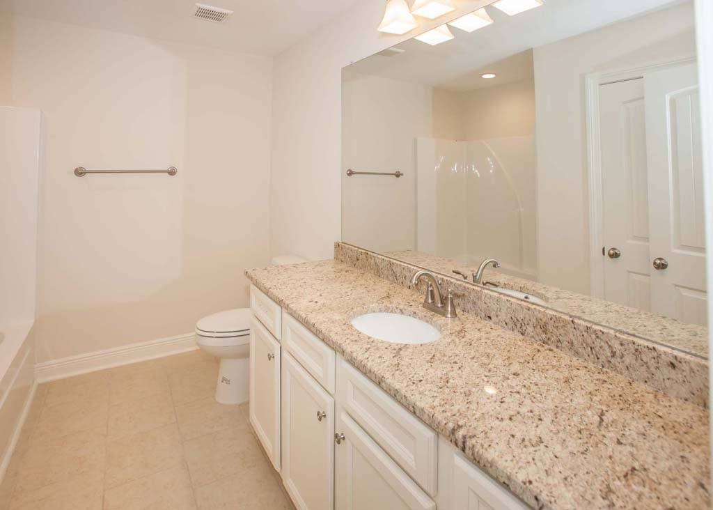 a bathroom with a sink and a toilet