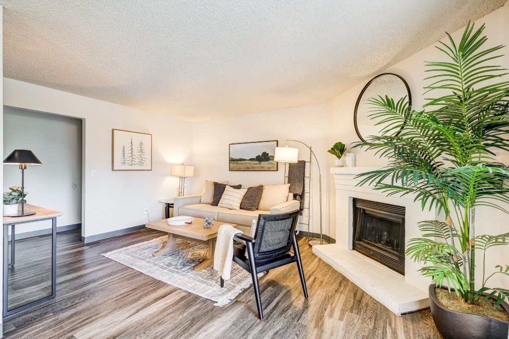 a living room with a couch and a fireplace