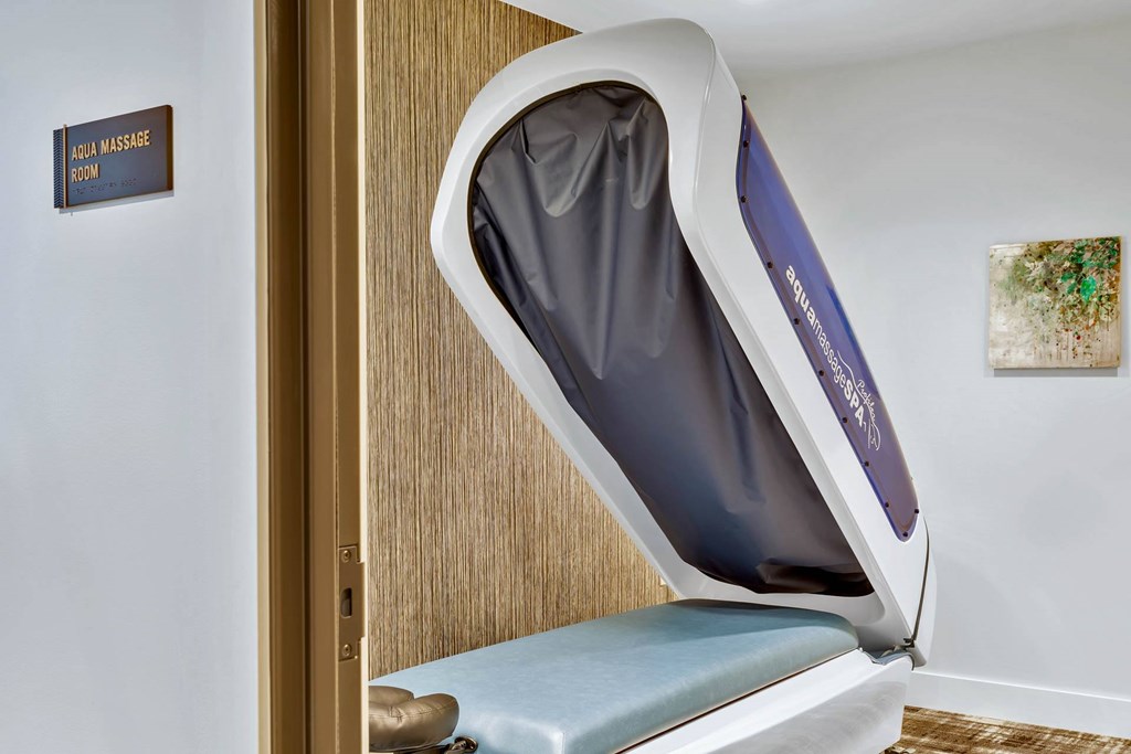 a massage chair in a room with a door