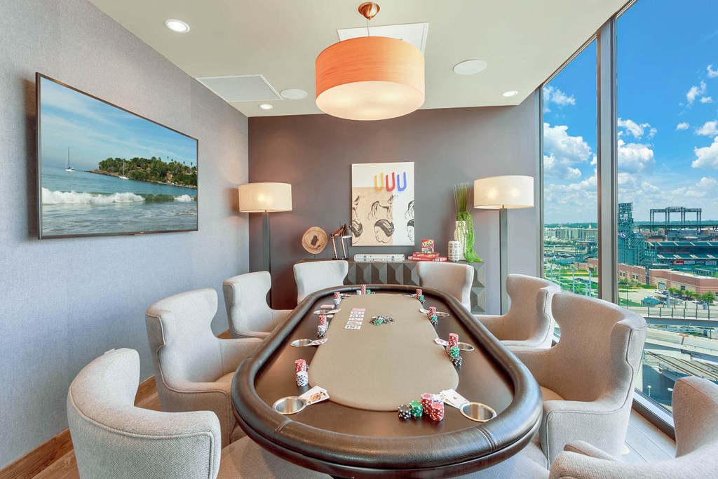a poker table in a hotel room with a view of the city