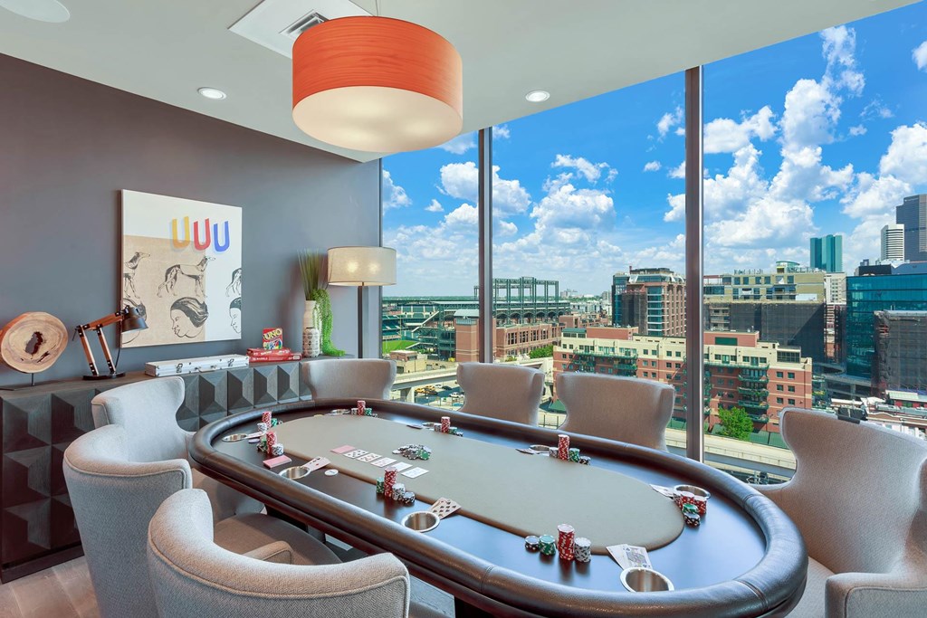 a poker table in a room with a view of the city