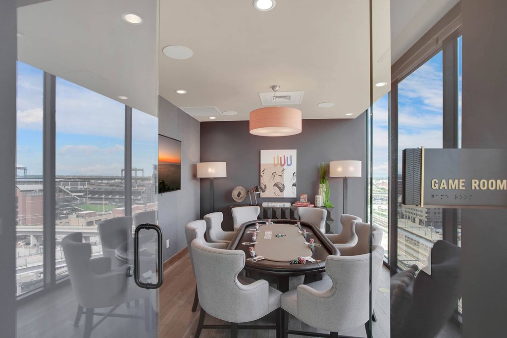 a conference room with a table and chairs and a view of a city