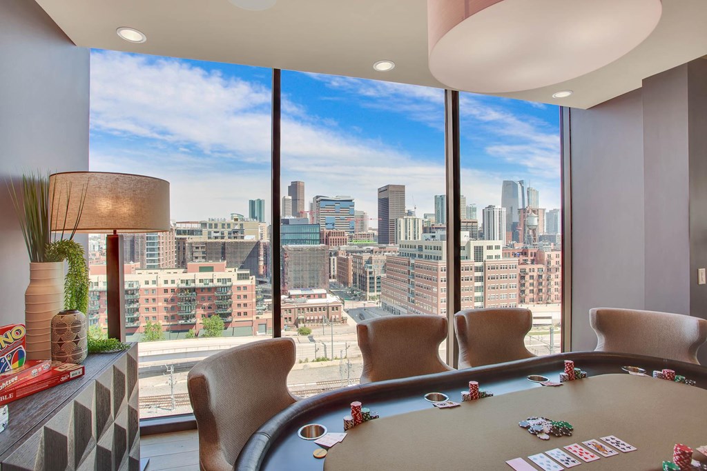 a view of the city from a room with a poker table