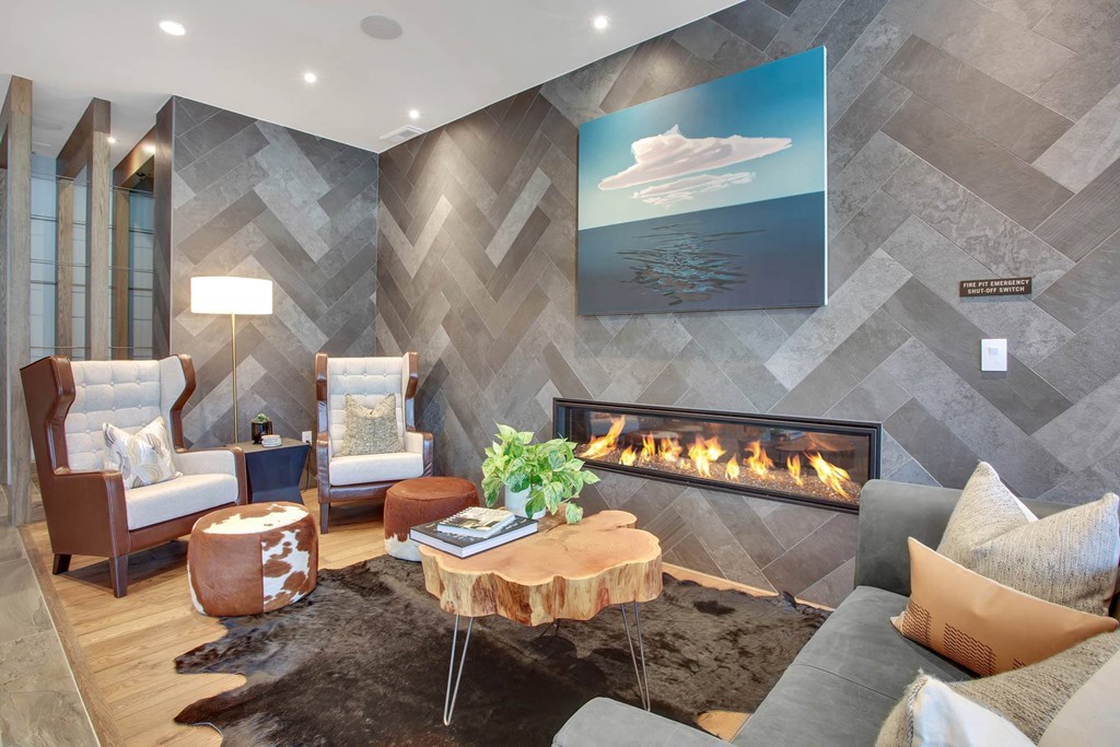 a living room filled with furniture and a fireplace