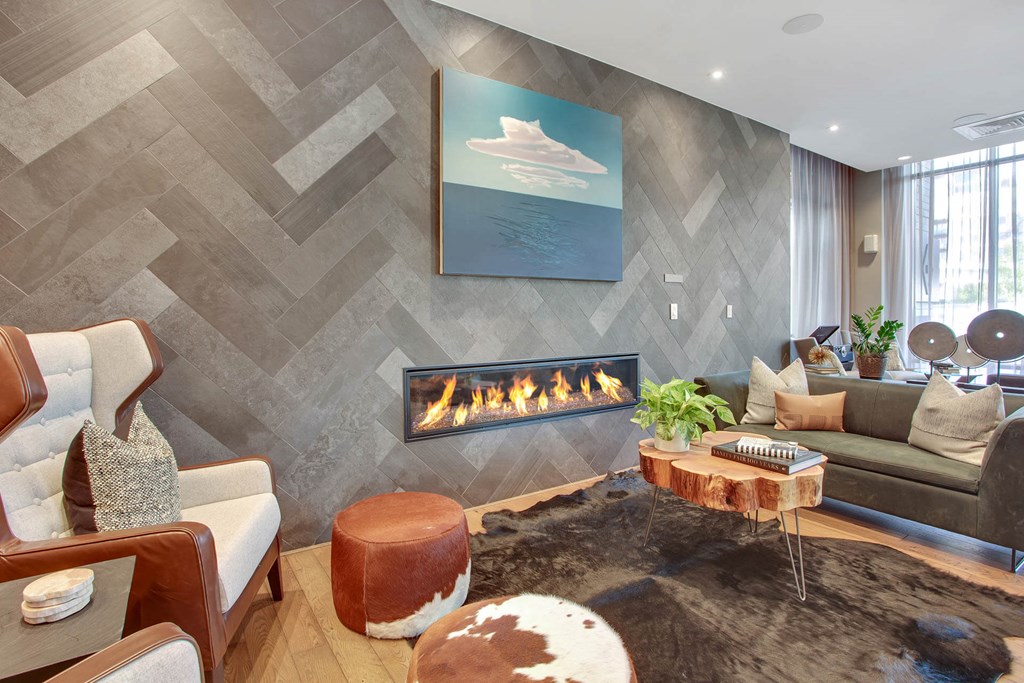 a living room filled with furniture and a fireplace