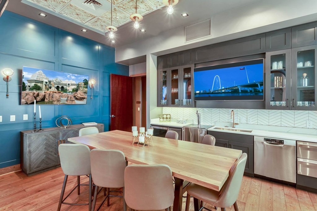 a dining room and kitchen with a table and chairs