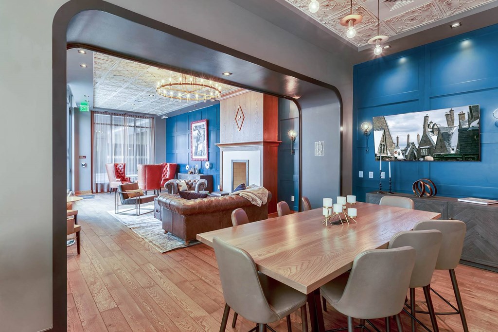 a living room with a dining room table and a couch