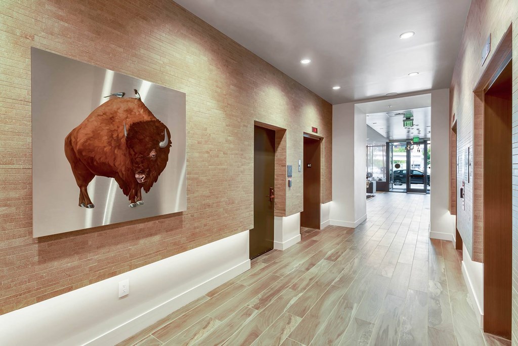 a large picture of a cow on a wall in a hallway