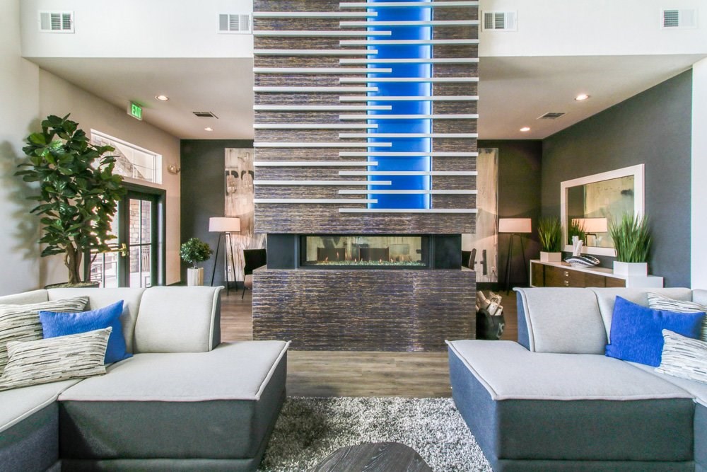 a living room with couches and a fireplace