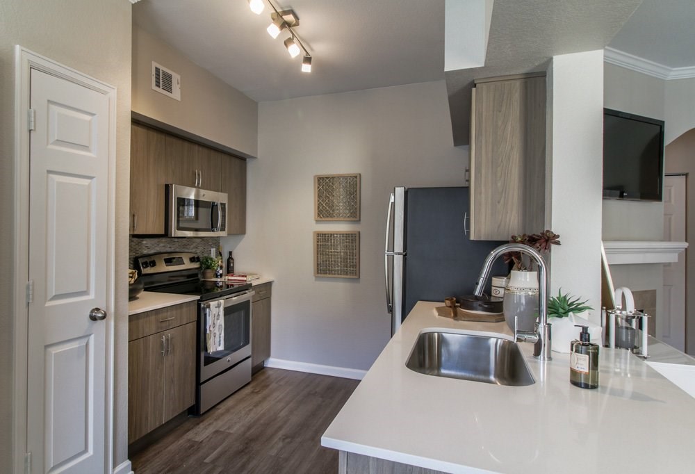 the preserve at ballantyne commons apartment kitchen with stainless steel appliances