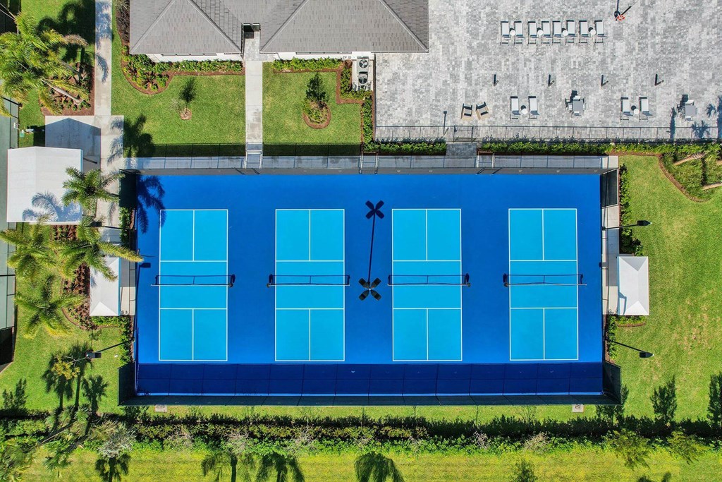 a aerial view of a tennis court with a blue court