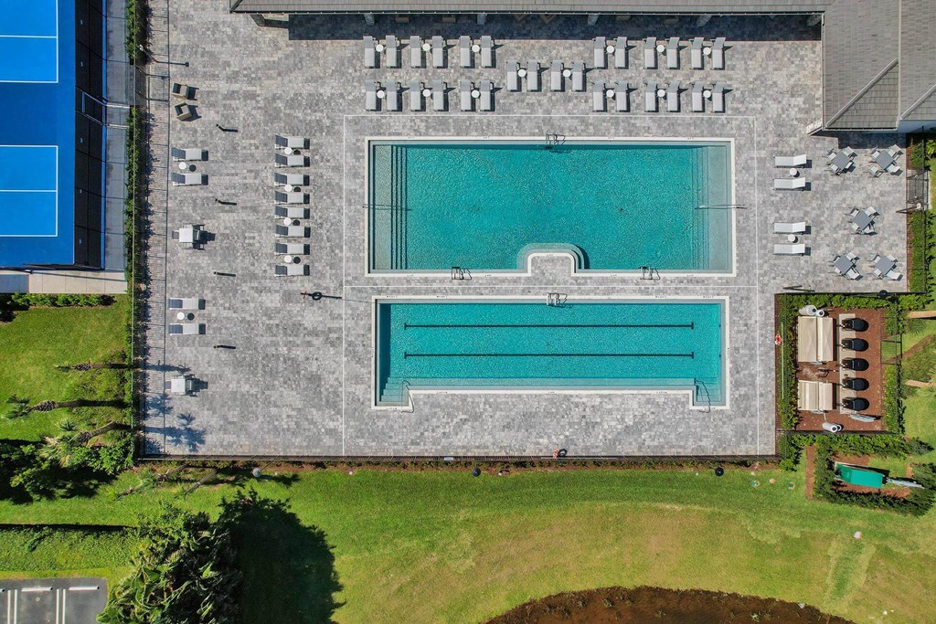 arial view of a swimming pool on the side of a building