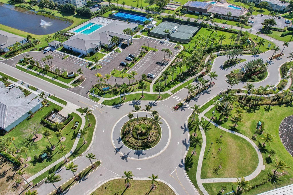 an aerial view of a parking lot with a roundabout