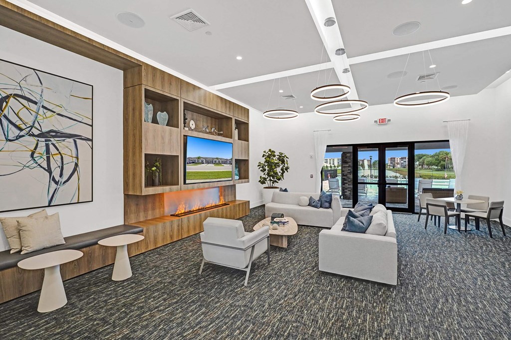 a living room with couches and chairs and a fireplace