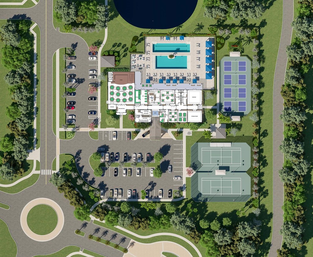 arial view of a building site with a parking lot and trees