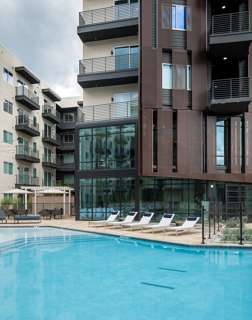 a building with a swimming pool in front of it