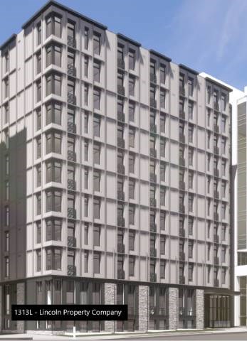 an image of an apartment building with a blue sky