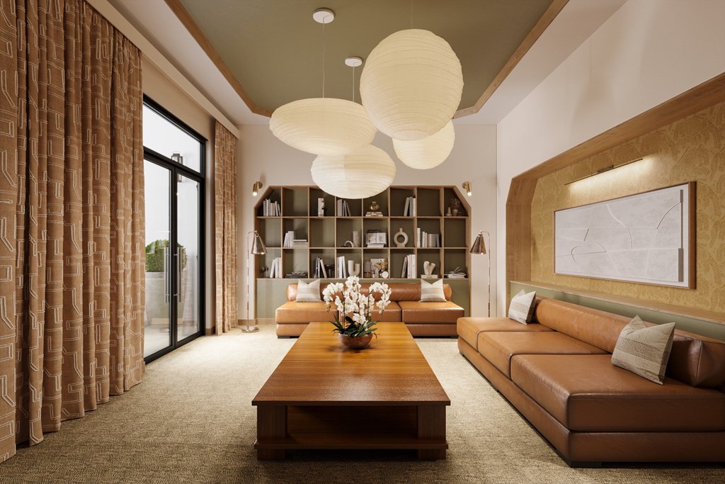 a living room with brown couches and a coffee table