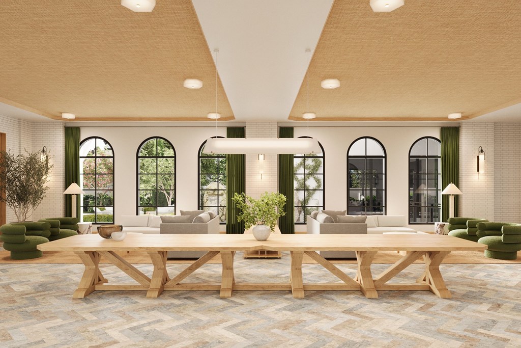 a large living room with a large table and chairs