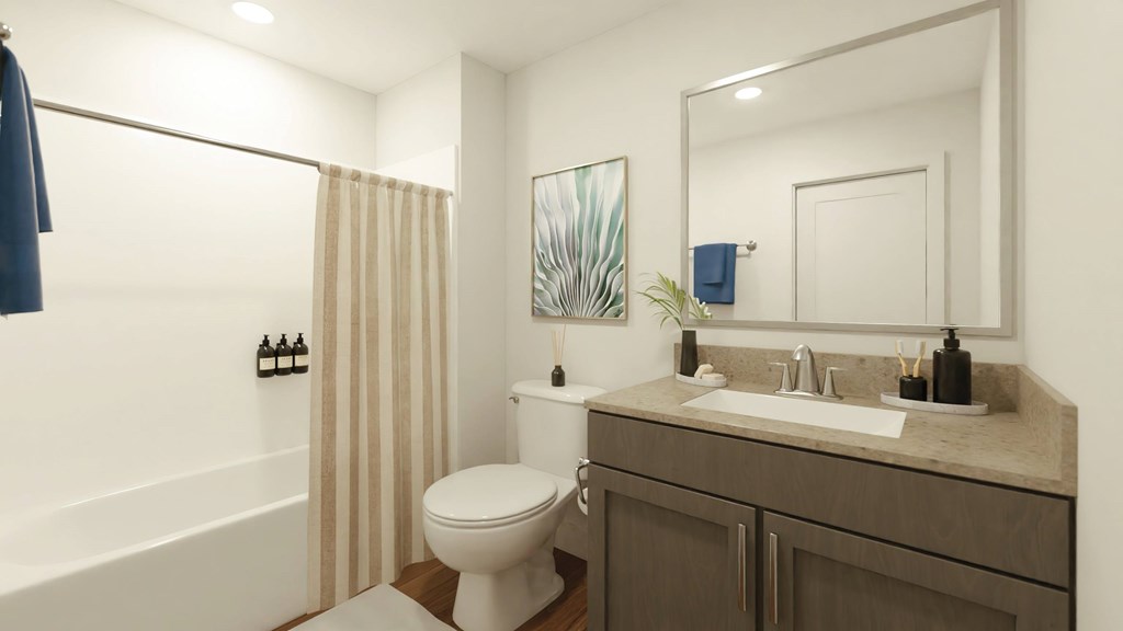 a bathroom with a toilet sink and shower