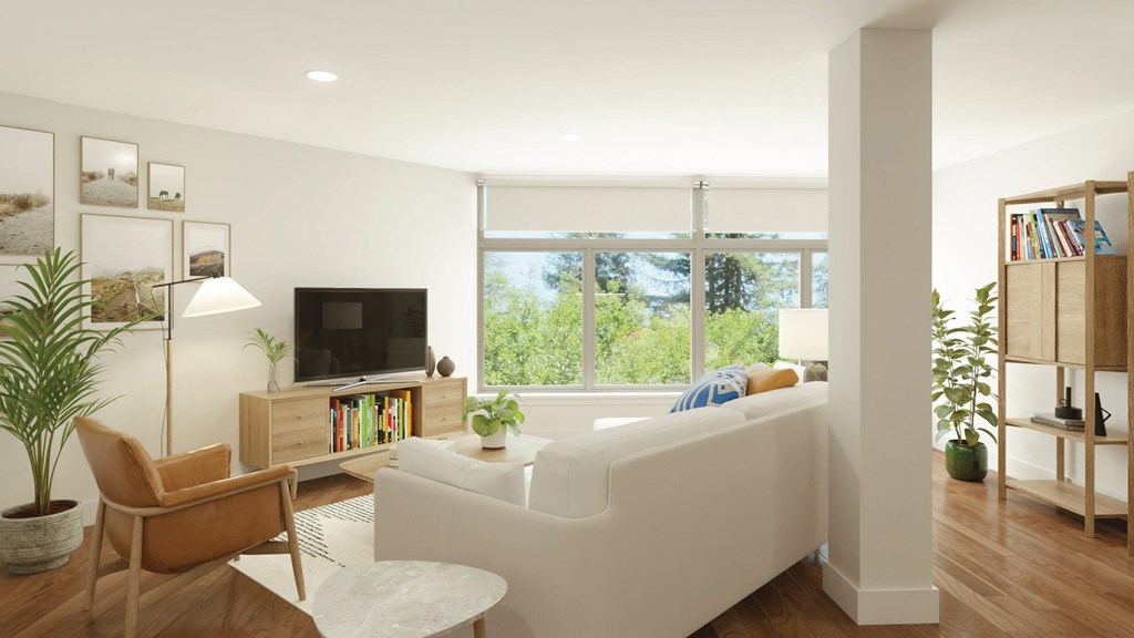 a living room with white furniture and a large window