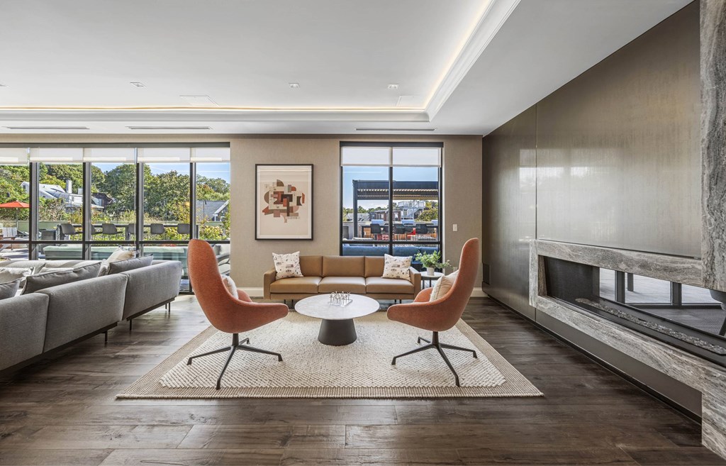a living room with a couch and a table and a fireplace