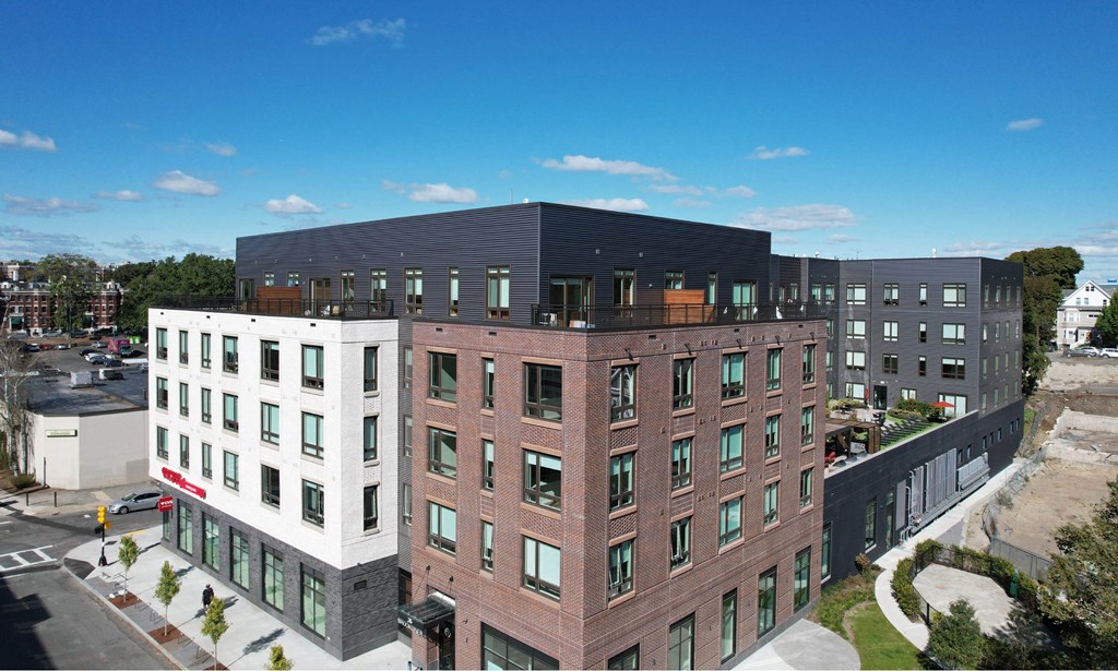 an aerial view of a large building with many windows