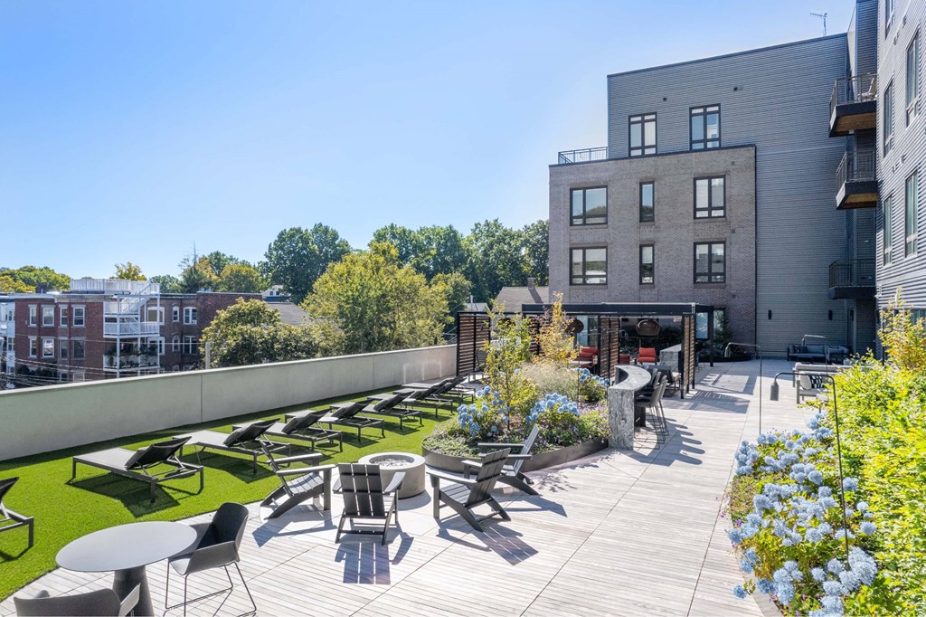a rendering of a rooftop patio with tables and chairs