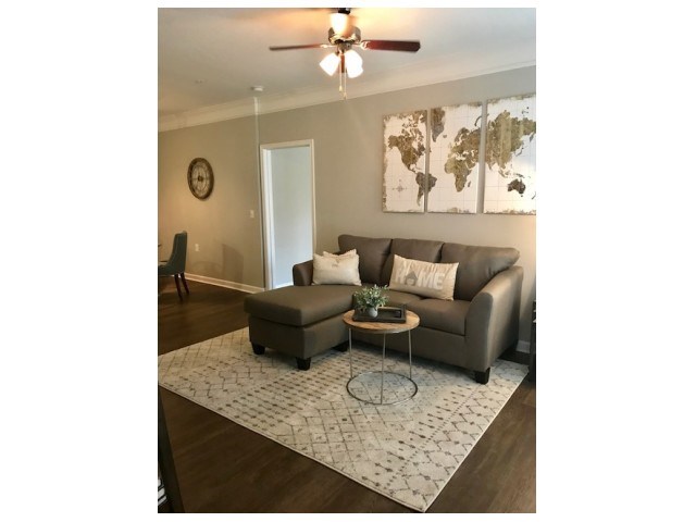 a living room with a couch and a table