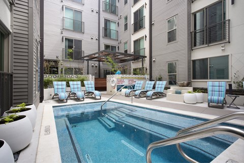 a swimming pool in the middle of an apartment building