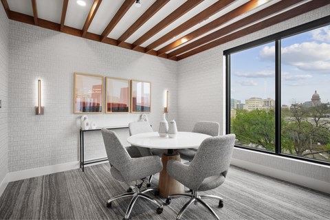 a conference room with a table and chairs
