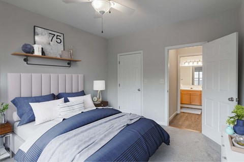 a blue and white bedroom with a large bed