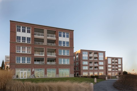 a view of the exterior of a new apartment building
